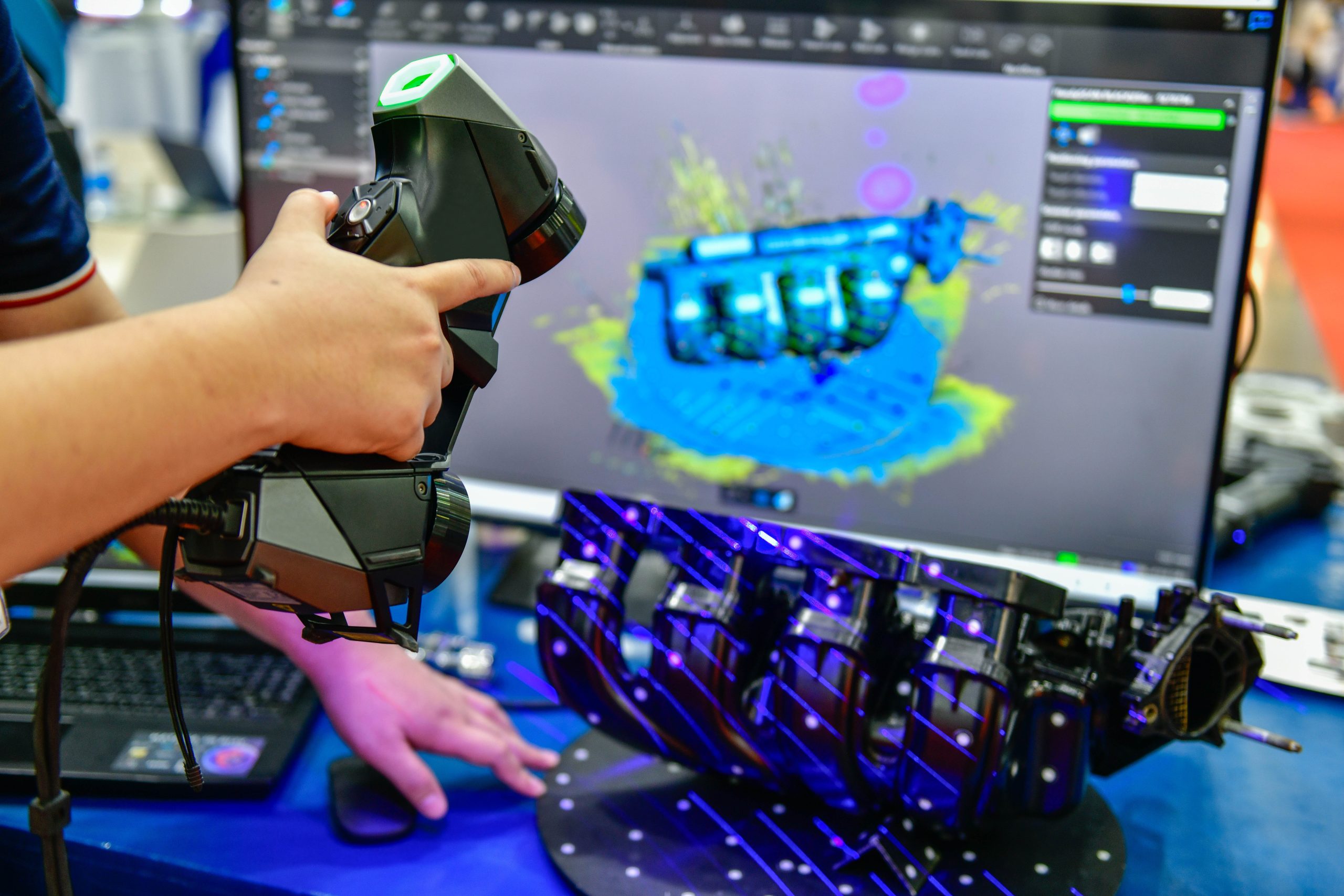 Portable 3D car-shaped handheld scanner is scanning to measure size and texture for future product development production in the automotive industry